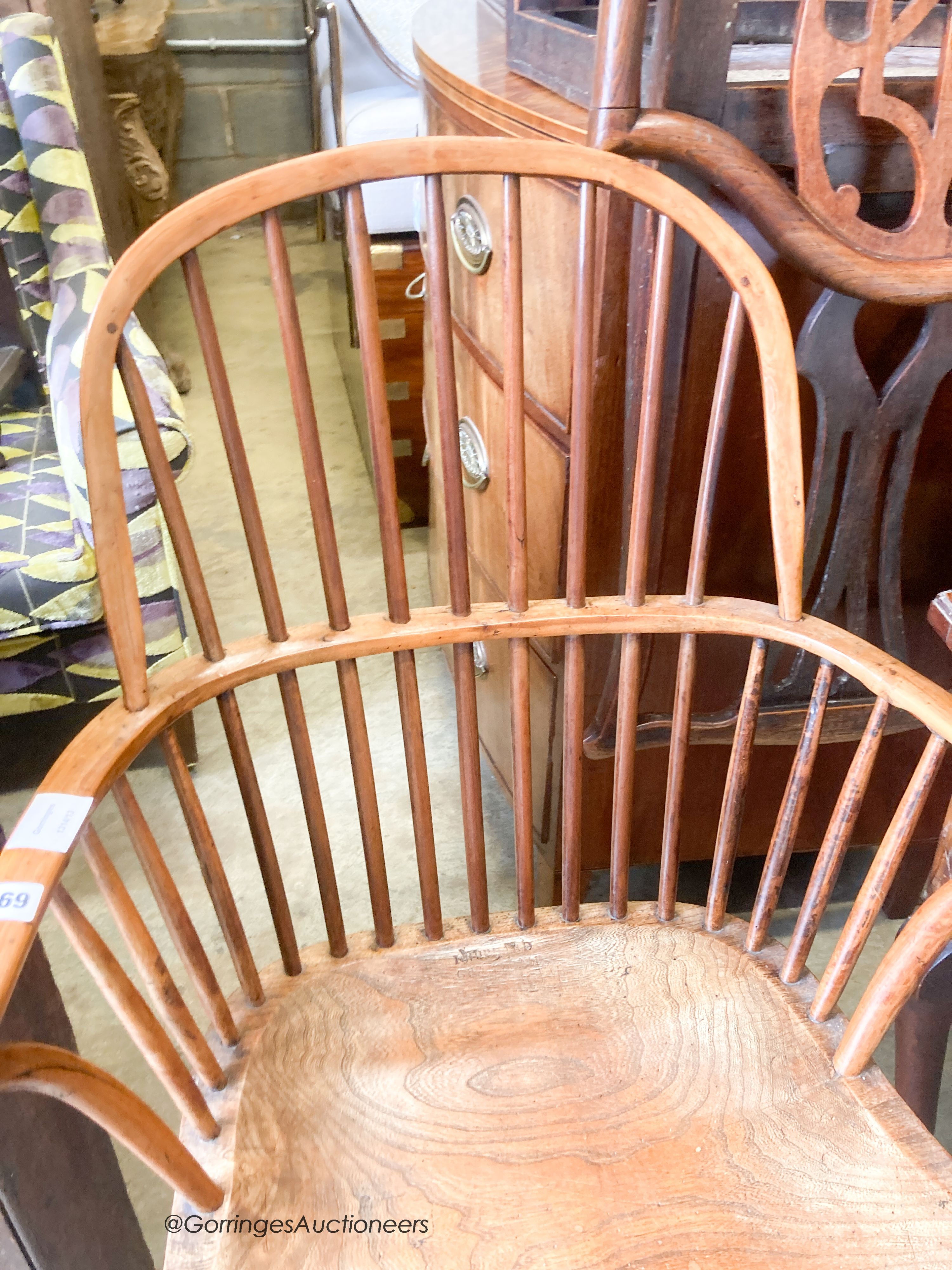 An early 19th century yew and elm Windsor elbow chair, width 59cm, depth 40cm, height 97cm